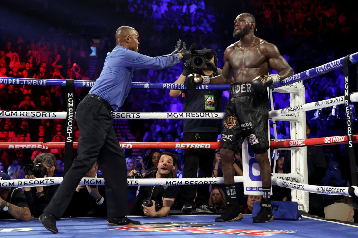 Referee Kenny Bayless sends Deontay Wilder to his corner during the Heavyweight bout for Wilder's WBC and Fury's lineal heavyweight title against Tyson Fury