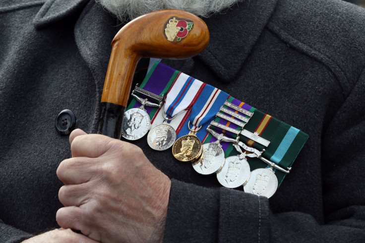 Former Ulster Defence Regiment (UDR) soldier, Tom Walker holds his engraved walking stick