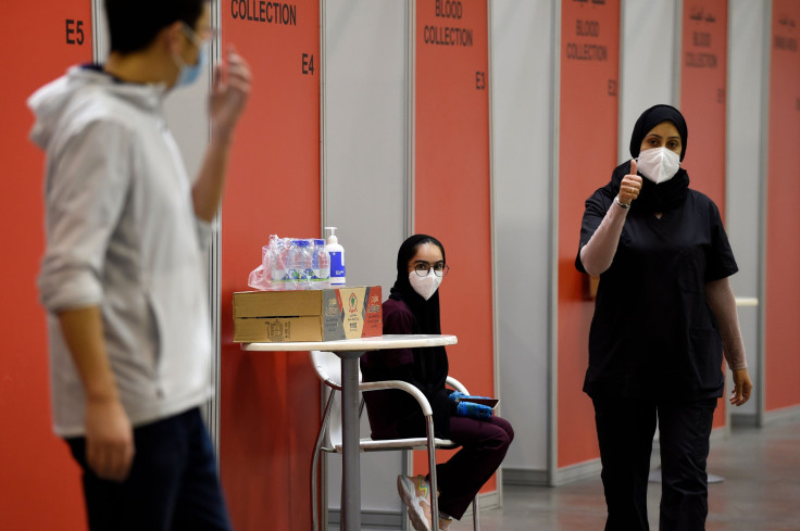 A nurse gives a thumbs up at Manama's repurposed convention centre, in which 6,000 people are participating in a large-scale trial of a Chinese-sponsored vaccine for the Covid-19 coronavirus, on August 27, 2020 in the Bahraini capital.