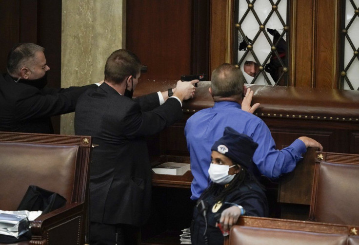 The disturbing visuals show a police officer being assaulted by a mob. 