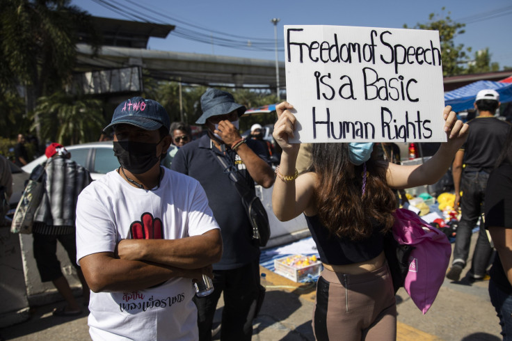 Pro-democracy protesters rally while their leaders report to hear section 112 charges filed against them on December 21, 2020 in Bangkok, Thailand.