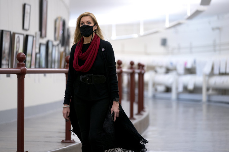 Rep. Beth Van Duyne (R-TX) wears a protective mask while walking through the Canon Tunnel to the U.S. Capitol 