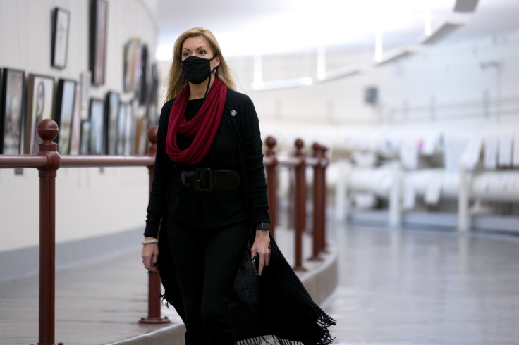 Rep. Beth Van Duyne (R-TX) wears a protective mask while walking through the Canon Tunnel to the U.S. Capitol