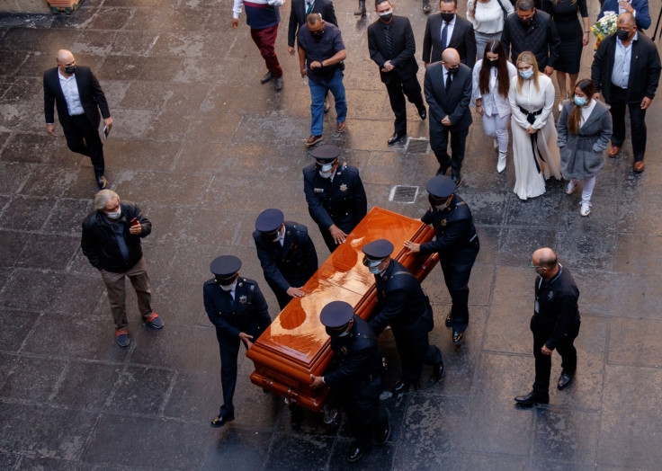 Relatives of the former governor of Jalisco Aristoteles Sandoval -murdered in Puerto Vallarta early this week- walk next to his coffin on its way to the Government Palace for a tribute, in Guadalajara, state of Jalisco, Mexico, on December 19, 2020.