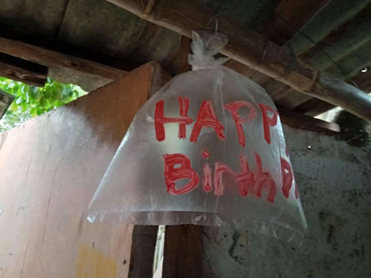 Filipino kids improvise to celebrate dad's birthday.