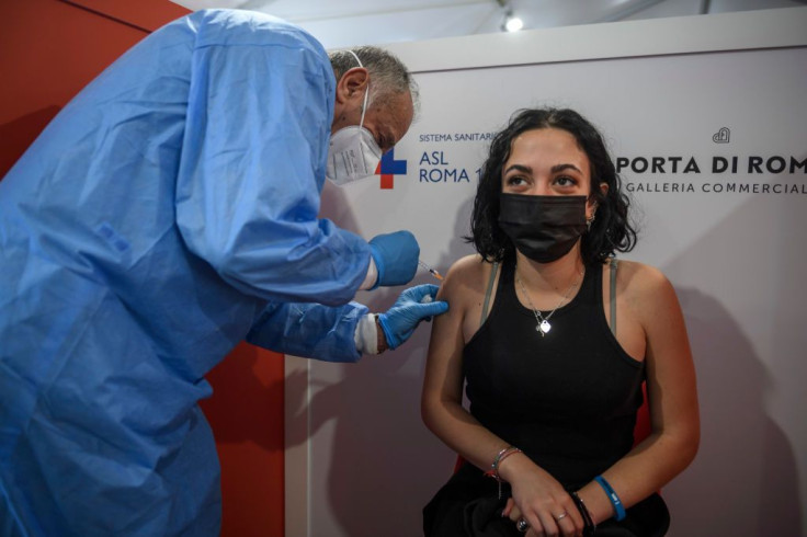 A student receives a dose of the Pfizer/BioNTech vaccine 