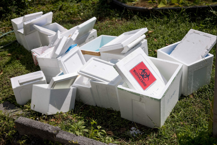 Polystyrene boxes labelled 'biohazard' sit outside the Urban Institute for Disease Prevention and Control in Bangkok