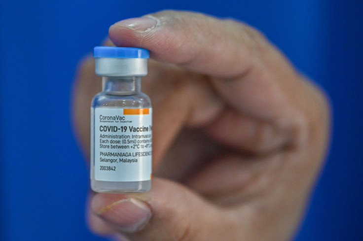 A medical staff member shows a bottle of the Sinovac Covid-19 coronavirus vaccine 