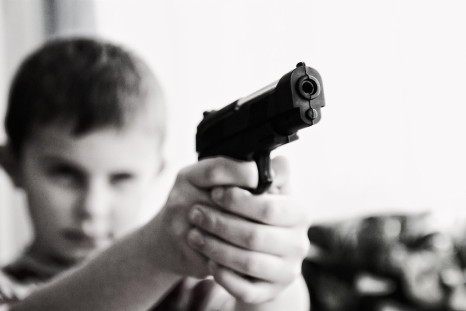 Child holding a gun