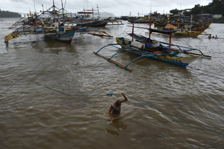 A filipino fishermen secure a boat as they prepare and resupply for another fishing trip to the Spratlys, on July 9, 2016 in Mariveles, Bataan, Philippines. 