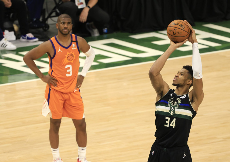 Giannis Antetokounmpo #34 of the Milwaukee Bucks shoots a free throw as Chris Paul #3 of the Phoenix Suns