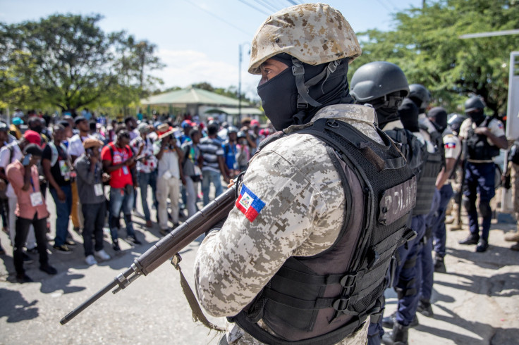 Journalists face armed police 