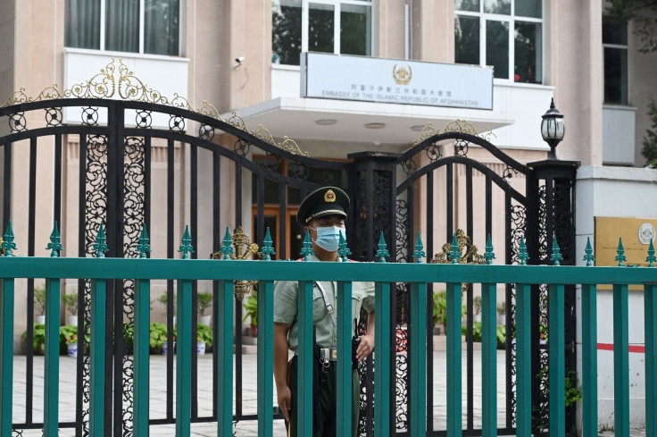 This photo taken on July 9, 2021 shows a Chinese paramilitary policeman standing guard outside the Afghanistan embassy in Beijing.