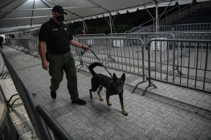 A K-9 handler walks with a specially trained dog