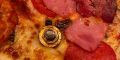 Pizza with nail and bolts topping