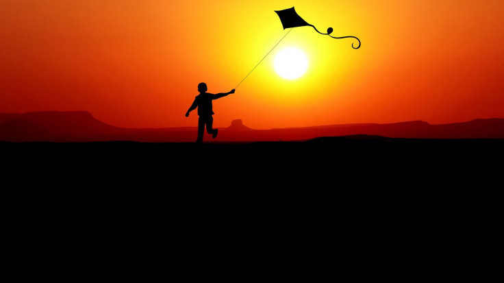 boy flying kite