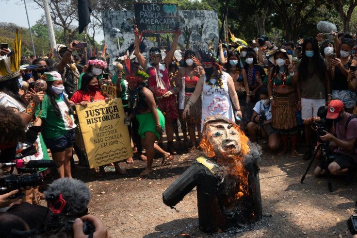 Indigenous women burn a doll depicting president of Brazil Jair Bolsonaro