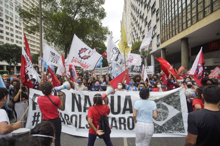 Demonstrators hold flags and banners during a demonstration against President Jair Bolsonaro