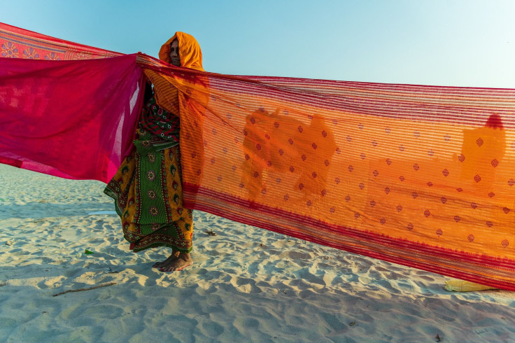 woman weaving saree