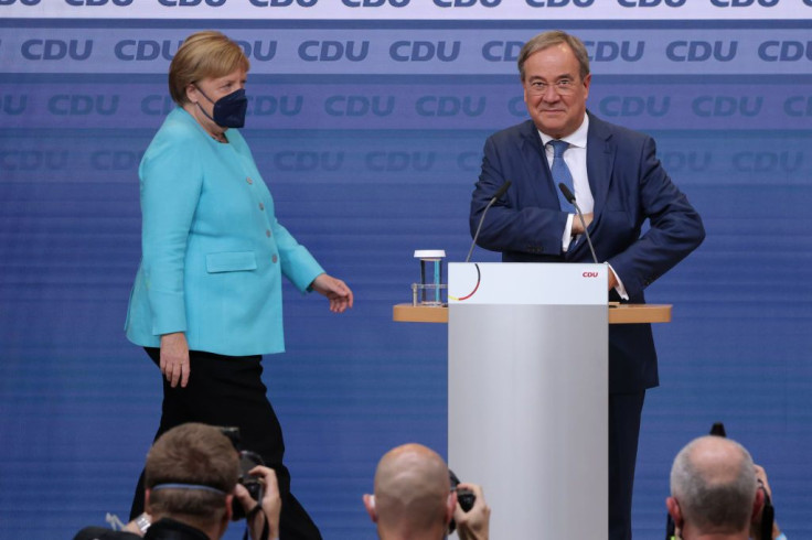Armin Laschet (R), chancellor candidate of the Christian Democrats (CDU/CSU), and German chancellor Angela Merkel 