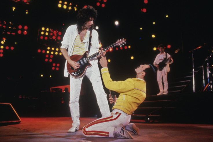Singer Freddie Mercury (1946 - 1991) and guitarist Brian May of British rock band Queen in concert at Wembley Stadium, July 1986. 
