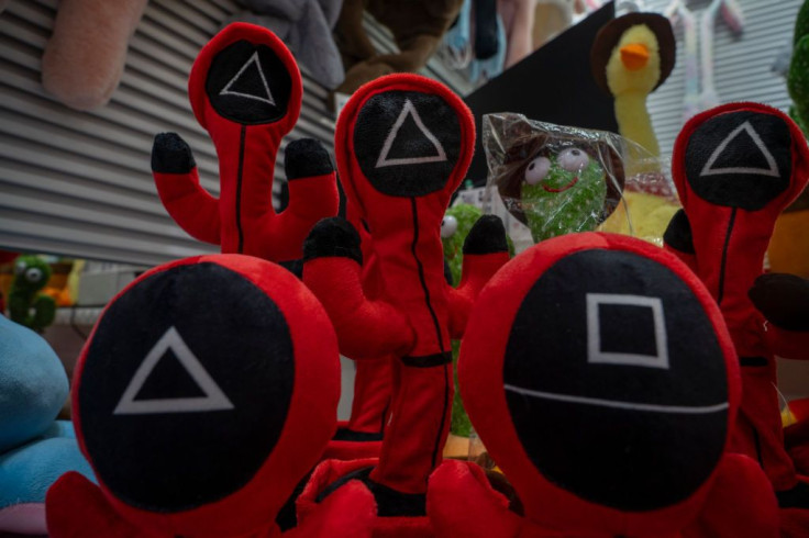 Toys inspired by 'Squid Game' are on display in a shop
