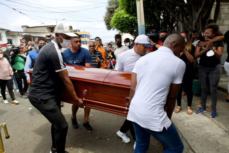 Relatives carry the coffin of Ecuadorian athlete Alex Quiñonez