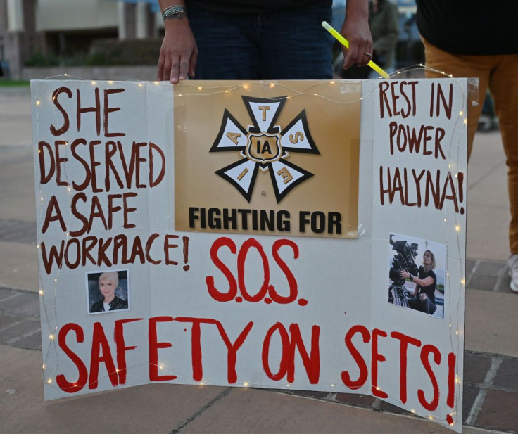 A sign calling for better safety on movie sets during a vigil held to honor cinematographer Halyna Hutchins 