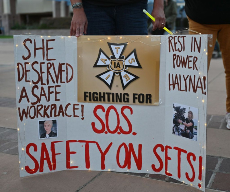 A sign calling for better safety on movie sets during a vigil held to honor cinematographer Halyna Hutchins