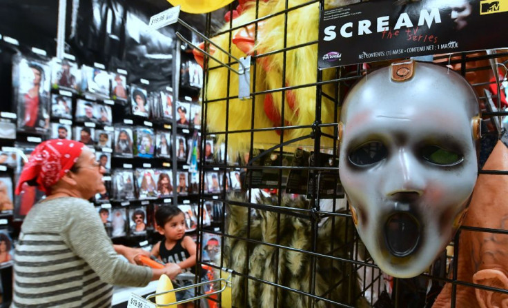 A mask from the TV series 'Scream' is displayed at a store selling Halloween merchandise