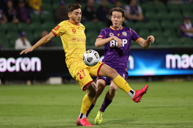 Josh Cavallo of Adelaide and Daniel Stynes of the Glory