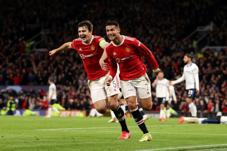 Cristiano Ronaldo of Manchester United celebrates with teammate Harry Maguire