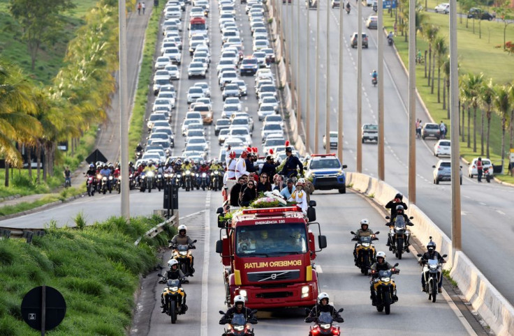 A military firefighter brigade truck carrying the remains of Brazilian singer Marilia Mendonca