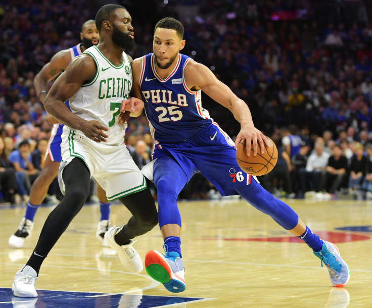 Ben Simmons #25 of the Philadelphia 76ers drives on Jaylen Brown #7 of the Boston Celtics