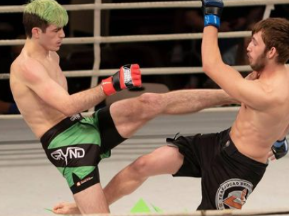 Christian Lohsen removes his testicle after being hit by a knee while training.