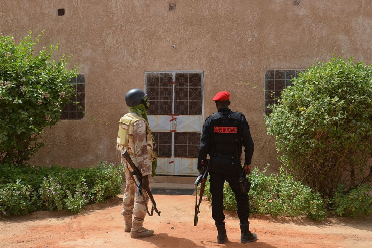 File picture of two members of Niger's security forces standing guard outside the home of Jeffery Woodke