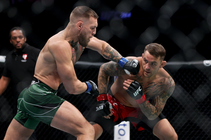 Conor McGregor of Ireland attempts a punch against Dustin Poirier in the first round in their lightweight bout during UFC 264: Poirier v McGregor 3