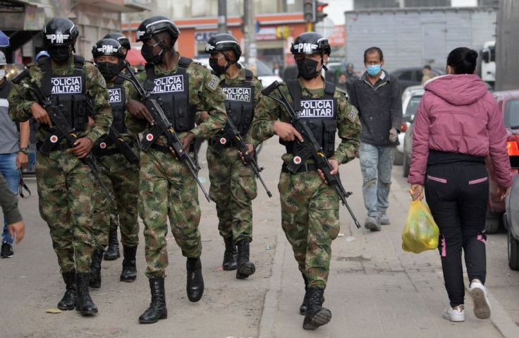 Military policemen patrol the streets in Bogota