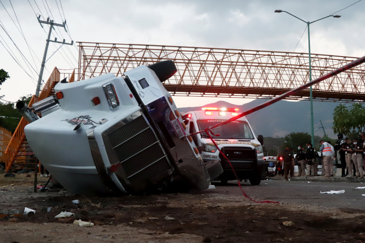 A truck that was transporting migrants is seen rolled over after a traffic accident that killed migrants from Central America on December 9, 2021 in Tuxtla Gutierrez, Mexico. 