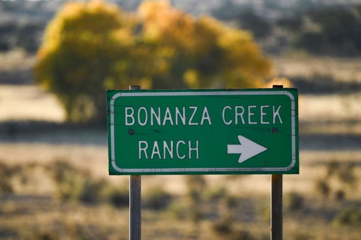 A sign points to the entrance of the Bonanza Creek Ranch where the film 'Rust' was filming
