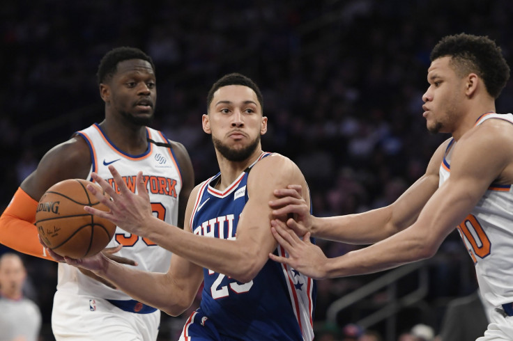 Ben Simmons #25 of the Philadelphia 76ers dribbles the ball against Julius Randle #30 and Kevin Knox II #20 of the New York Knicks