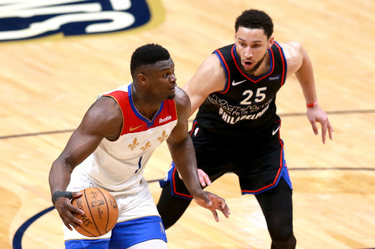 Zion Williamson #1 of the New Orleans Pelicans is defended by Ben Simmons #25 of the Philadelphia 76ers 