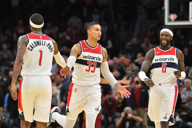  Kentavious Caldwell-Pope #1 and Montrezl Harrell #6 celebrate with Kyle Kuzma #33 of the Washington Wizards