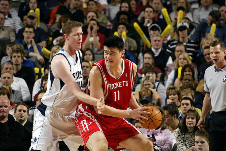 File picture of Shawn Bradley and Yao Ming
