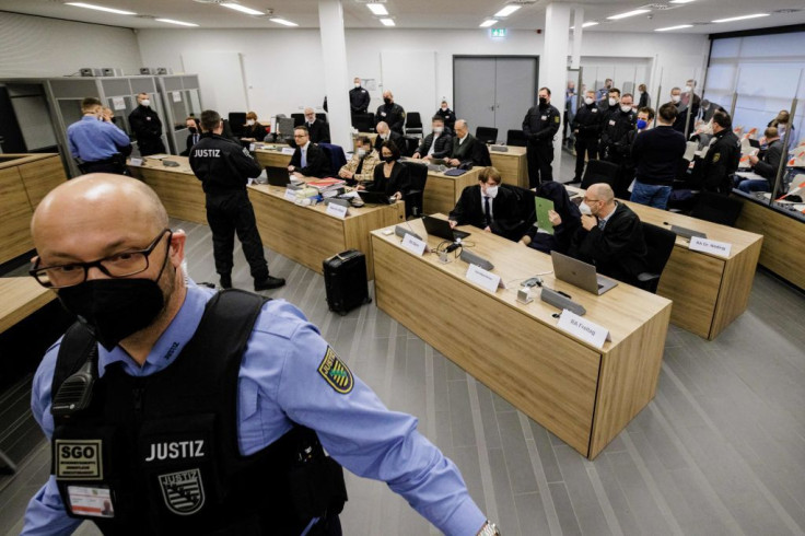 Defendants sit next to their lawyers at the Higher Regional Court in Dresden