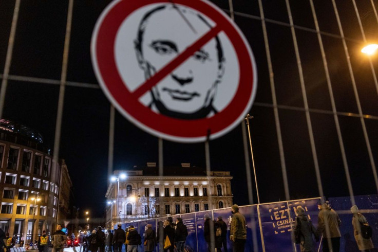 Anti-Putin placard outside the Russian owned international investment bank 