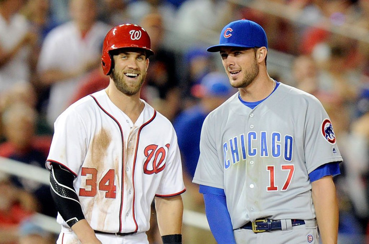 Bryce Harper #34 of the Washington Nationals talks with Kris Bryant #17 of the Chicago Cubs