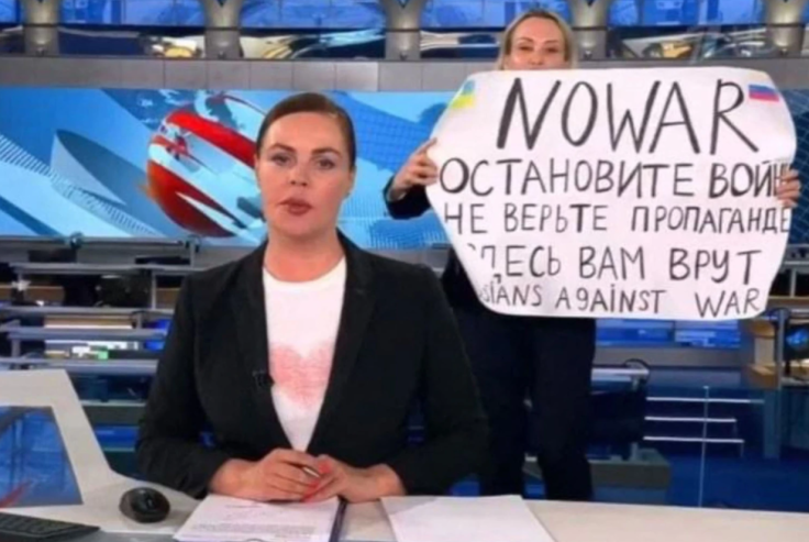 Russian journalist interrupts live news.