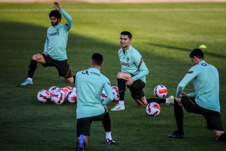 Portugal's national football team forward Cristiano Ronaldo (C) takes part in a training session