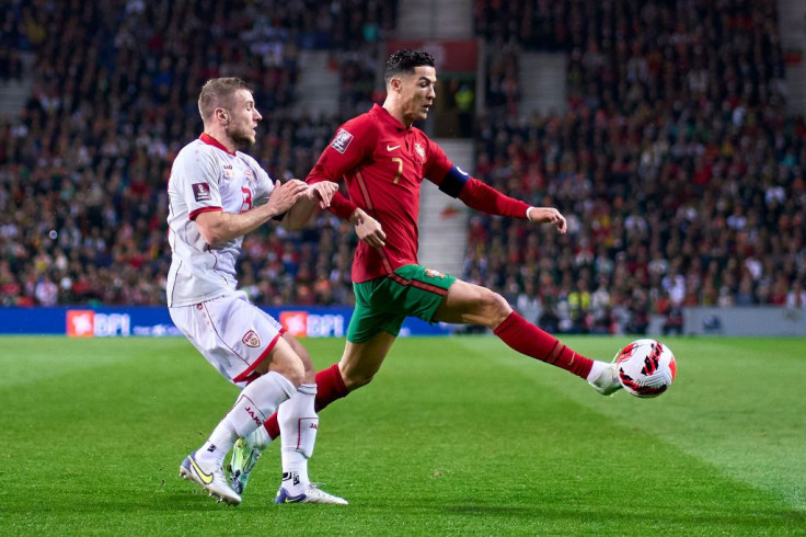 Stefan Ristovski of North Macedonia and Cristiano Ronaldo of Portugal